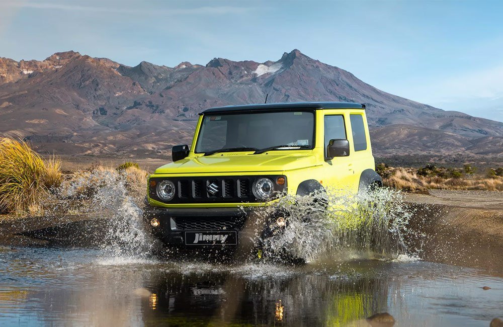Yellow Jimny driving through water