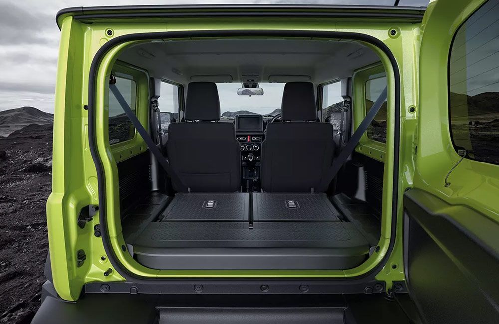 Rear of a Jimny with the boot open and rear seats down