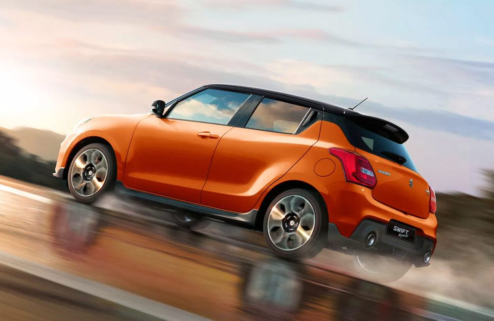Orange swift sport driving fast